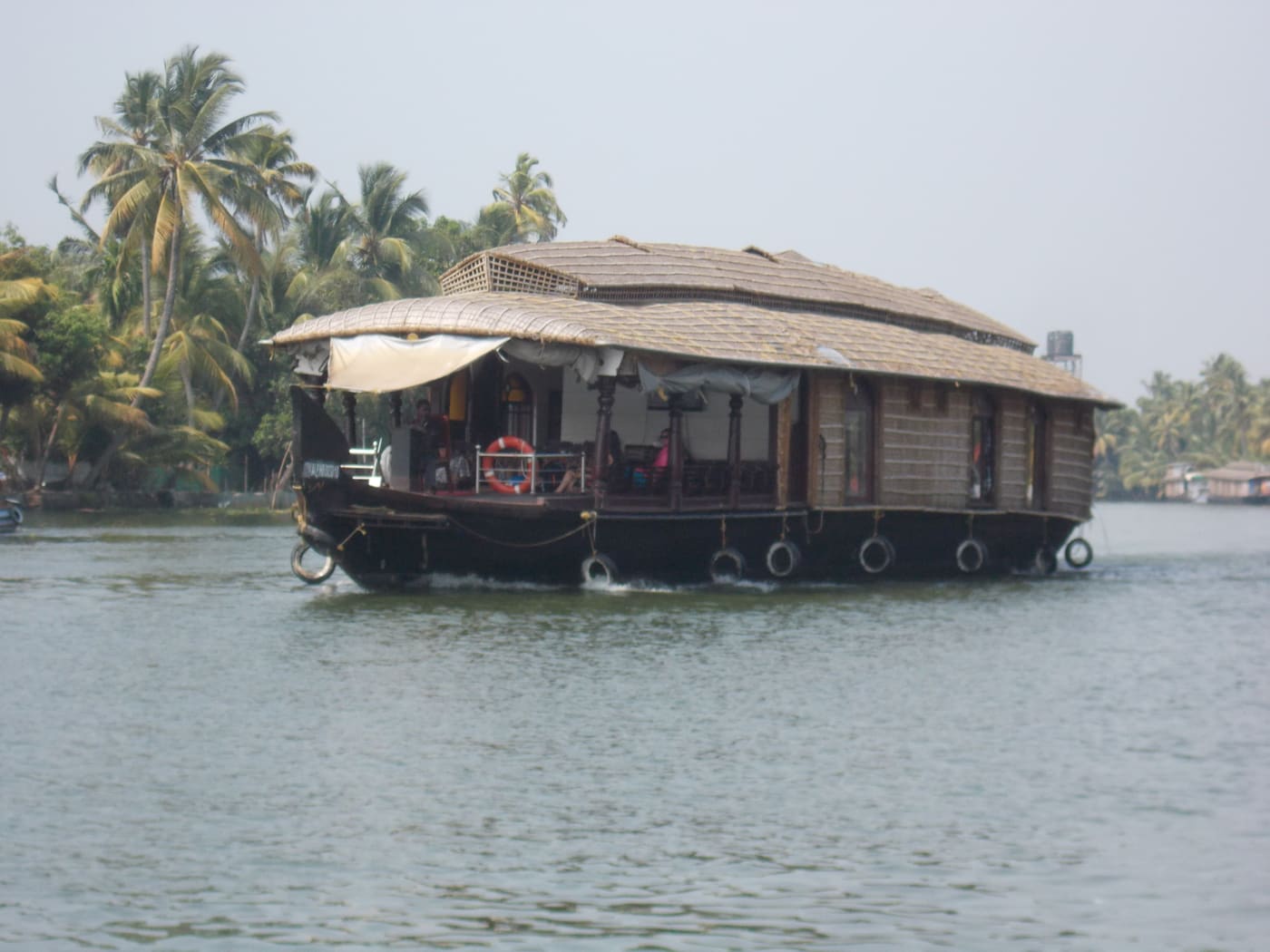 A traditional kettuvallam houseboat on the Kerala backwaters